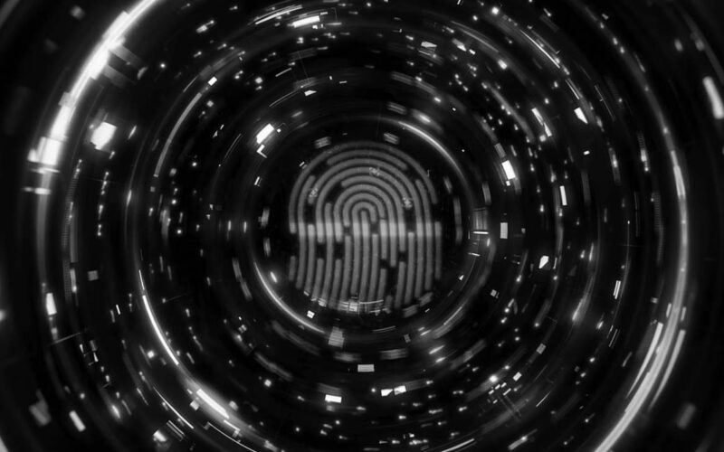 A glowing orange fingerprint is centered within a circular digital tunnel of blue and orange lights, suggesting advanced technology and Two-Factor Authentication to help protect companies in Portland through biometric identification.