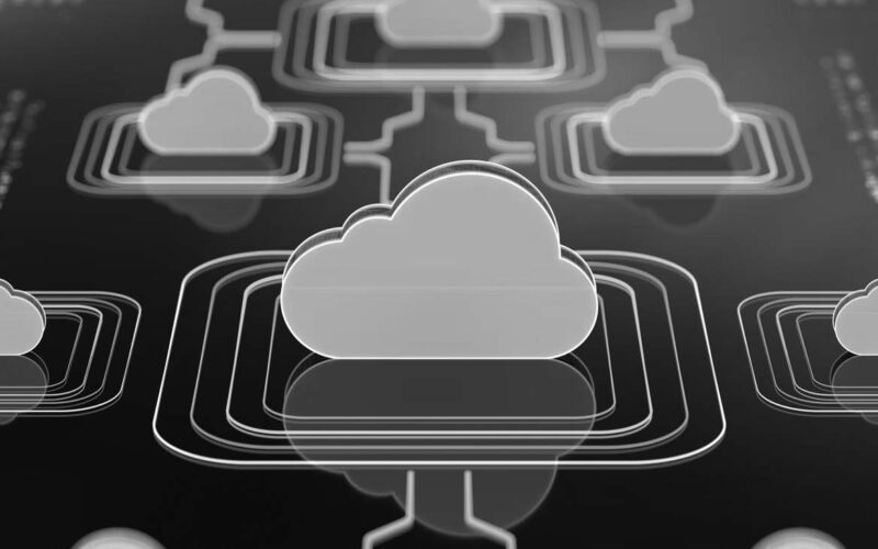 Illustration of multiple orange cloud icons interconnected by lines on a dark background, representing cloud computing or cloud network infrastructure—ideal for topics like cybersecurity or cybersecurity insurance.