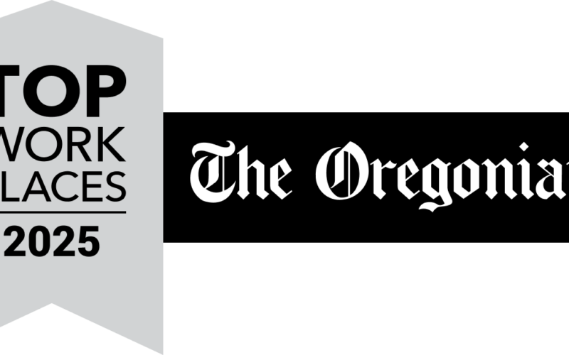 A yellow ribbon graphic reads Top Workplaces 2022 next to a blue banner featuring The Oregonian and OregonLive logos in white, highlighting Pavelcomm’s recognition.