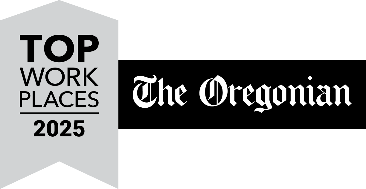 A yellow ribbon graphic reads Top Workplaces 2022 next to a blue banner featuring The Oregonian and OregonLive logos in white, highlighting Pavelcomm’s recognition.